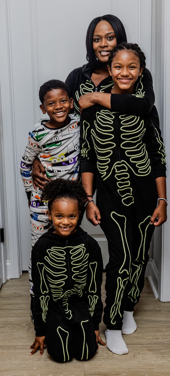 Family Halloween session in matching skeleton outfits