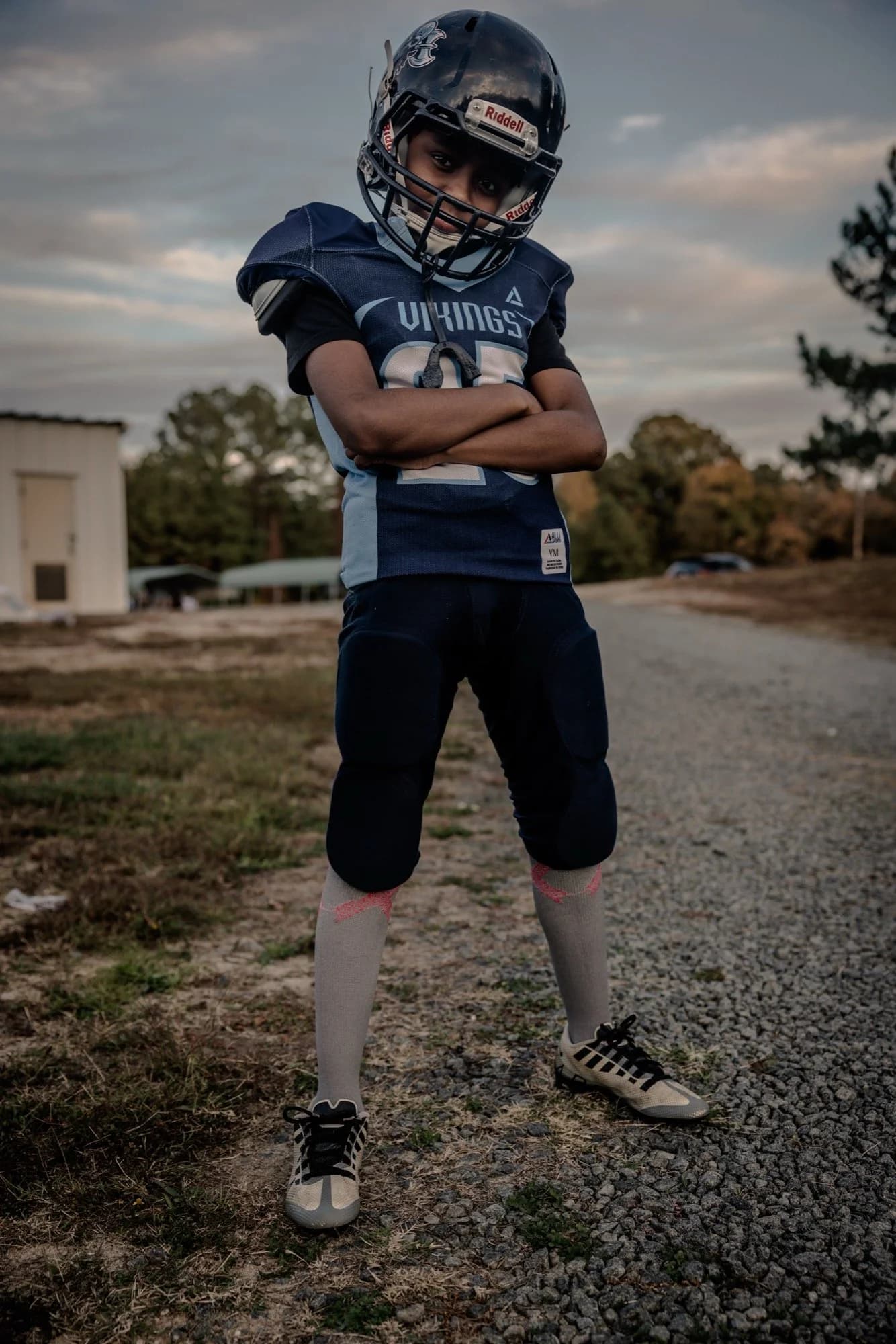 Youth football portrait with dramatic sky